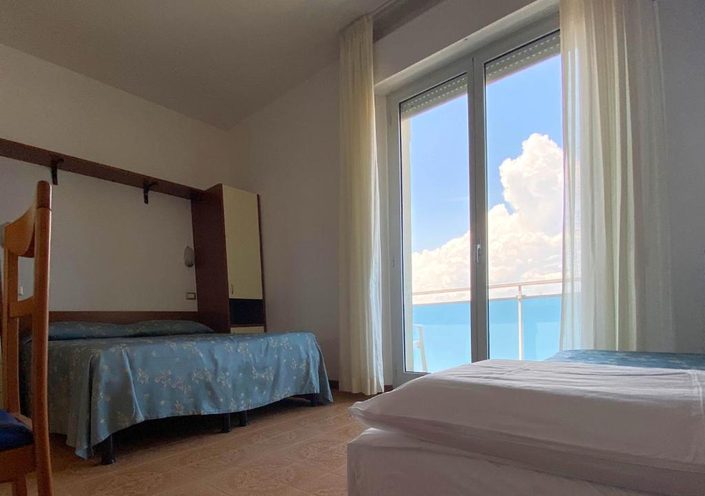 Кровать или кровати в номере Hotel Sayonara