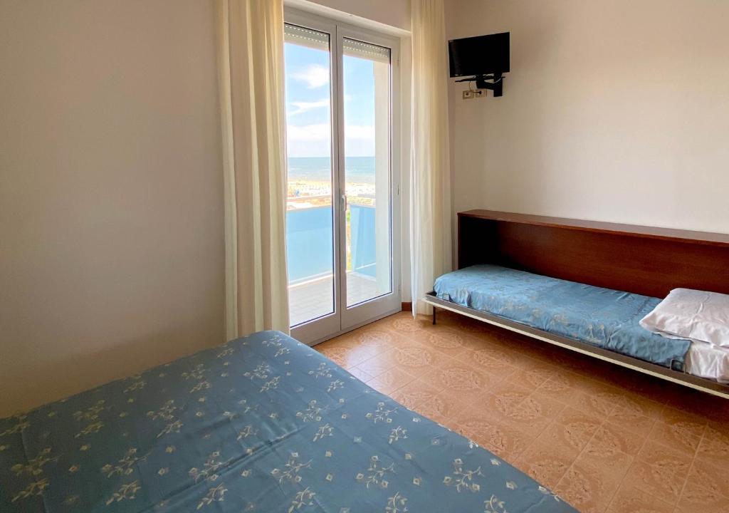 Кровать или кровати в номере Hotel Sayonara
