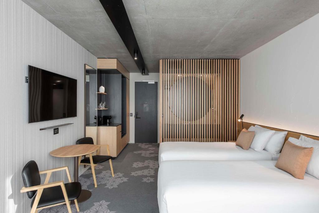 Postel nebo postele na pokoji v ubytování Vibe Hotel Adelaide