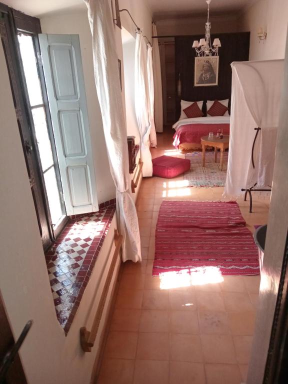 Postel nebo postele na pokoji v ubytování Riad le Jardin de Mina