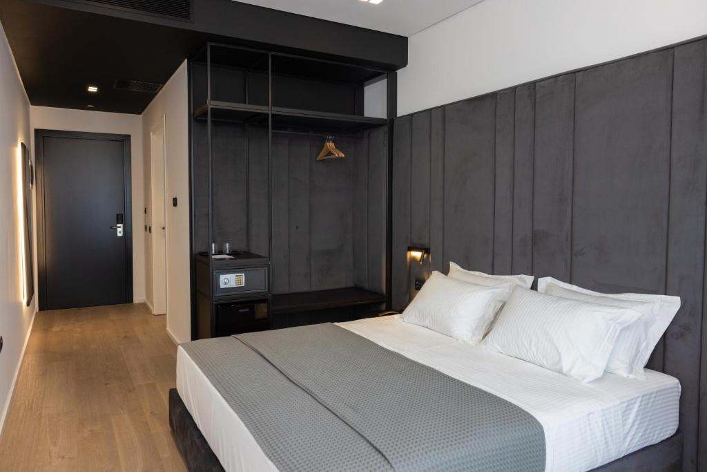 Postel nebo postele na pokoji v ubytování Lans Hotel