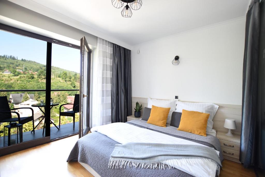 Postel nebo postele na pokoji v ubytování Apartament Przemiły - Studio Tęczowe Wzgórze