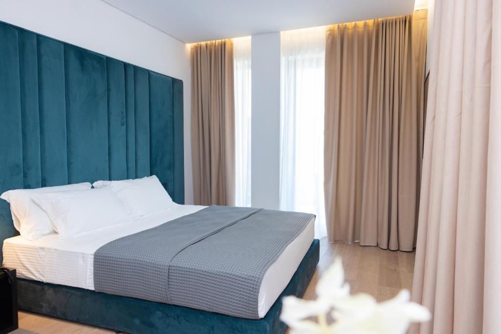 Postel nebo postele na pokoji v ubytování Lans Hotel
