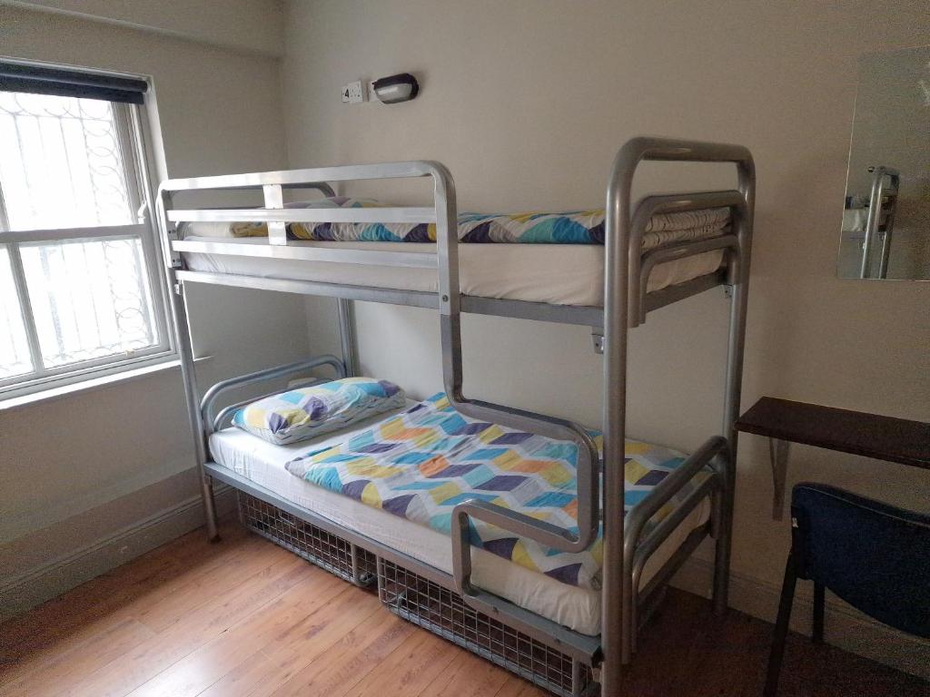 Postel nebo postele na pokoji v ubytování Bru Bar & Hostel