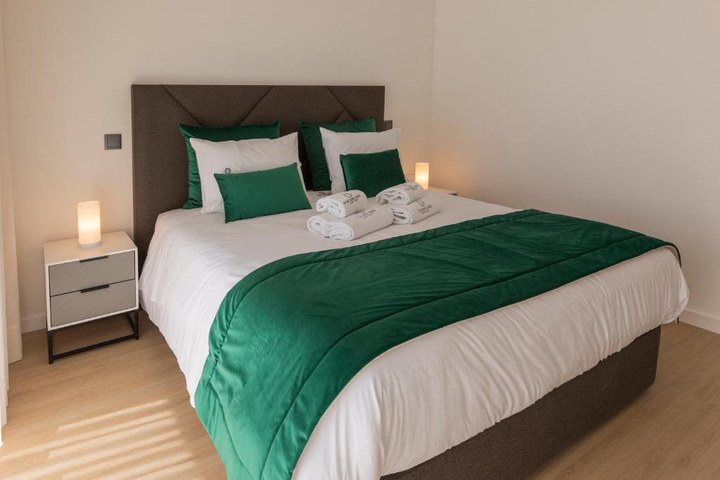 Postel nebo postele na pokoji v ubytování Guest House Fojo dos Lobos
