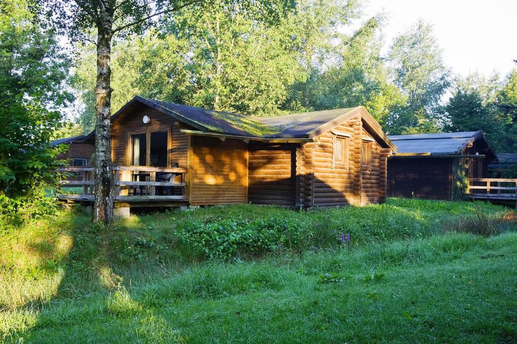 a log cabin in the middle of a field at Holiday home in Hechthausen with terrace in Hechthausen
