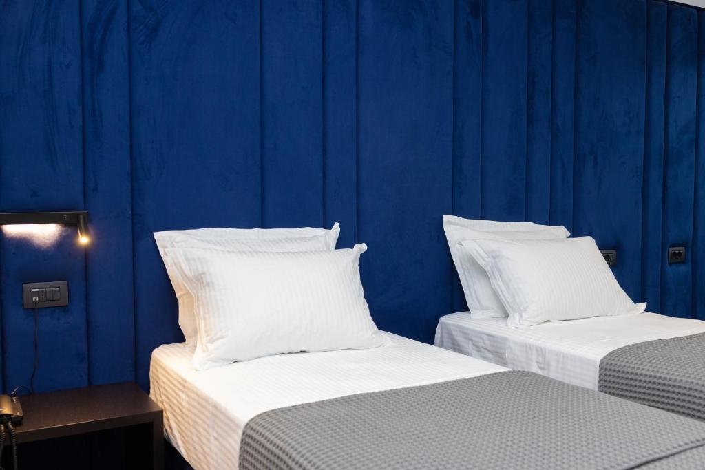 Postel nebo postele na pokoji v ubytování Lans Hotel