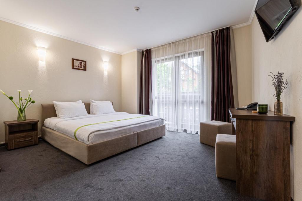 Postel nebo postele na pokoji v ubytování Graal resort