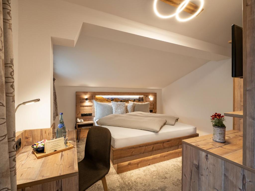 Postel nebo postele na pokoji v ubytování Hotel Garni Ferienhof