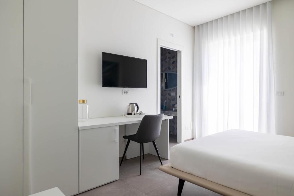 TV a/nebo společenská místnost v ubytování Marea Charme Rooms