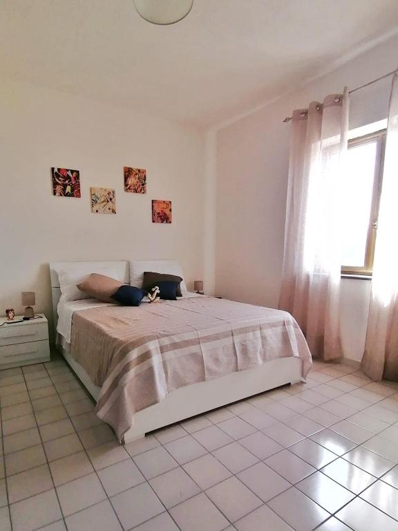 Postel nebo postele na pokoji v ubytování B&B Orizzonte Blu