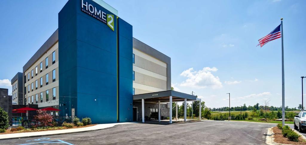 a large blue building with a sign on it at Home2 Suites By Hilton Birmingham/Fultondale, Al in Fultondale