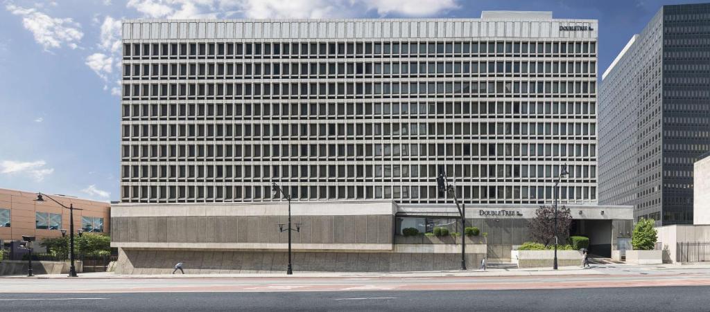 a large office building in front of a street at DoubleTree by Hilton Newark Penn Station, NJ in Newark