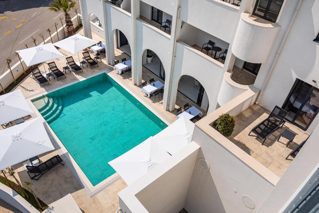an aerial view of a hotel with a swimming pool at Miramare Hotel in Zadar