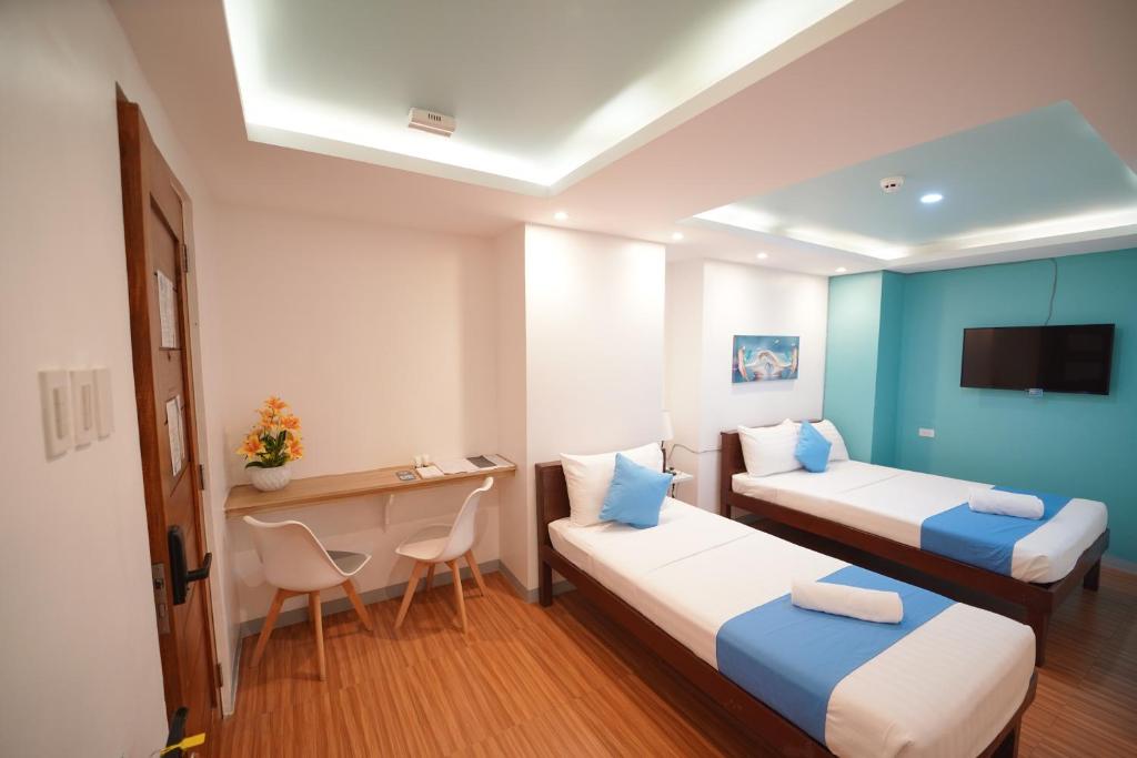 Postel nebo postele na pokoji v ubytování Arzo Hotel Premier