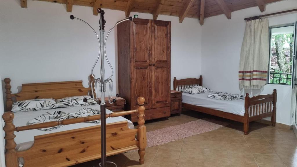 Postel nebo postele na pokoji v ubytování Bujtina Te Grima