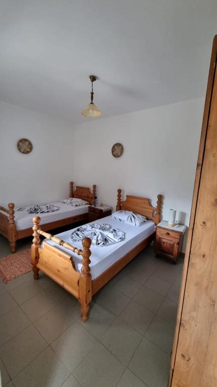 Postel nebo postele na pokoji v ubytování Bujtina Te Grima