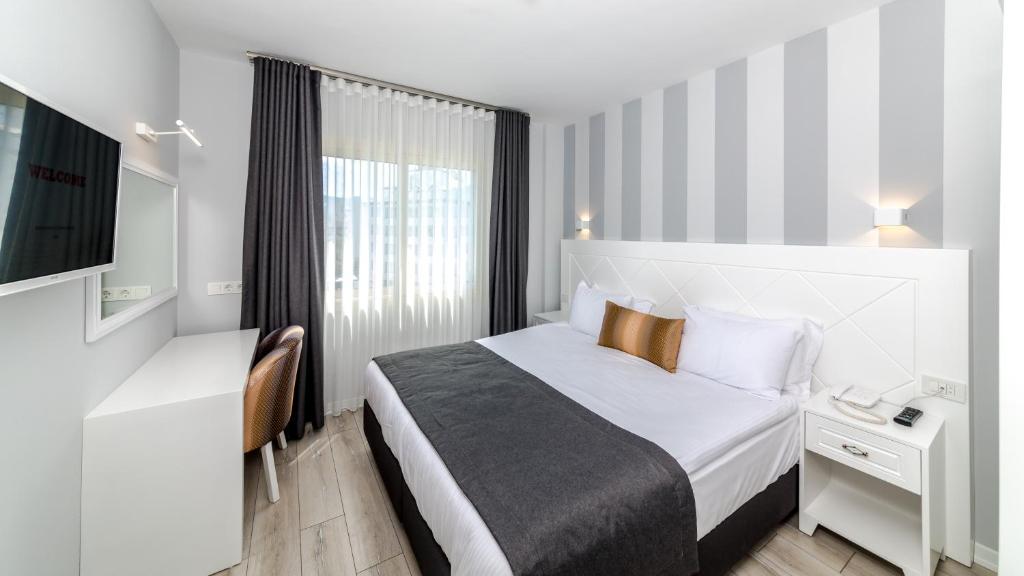 Кровать или кровати в номере Motto Premium Hotel&Spa