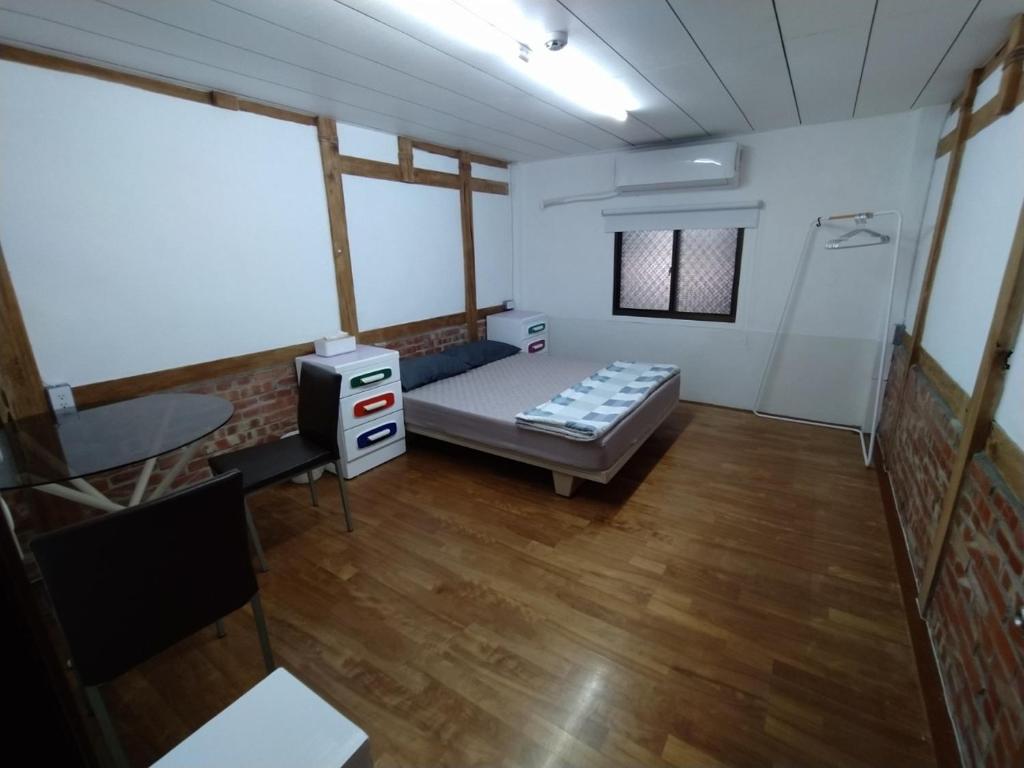 Postel nebo postele na pokoji v ubytování 順耆自然Shun Ci Zih Ran