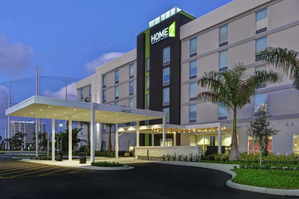 an exterior view of a hotel at Home2 Suites By Hilton West Palm Beach Airport in West Palm Beach