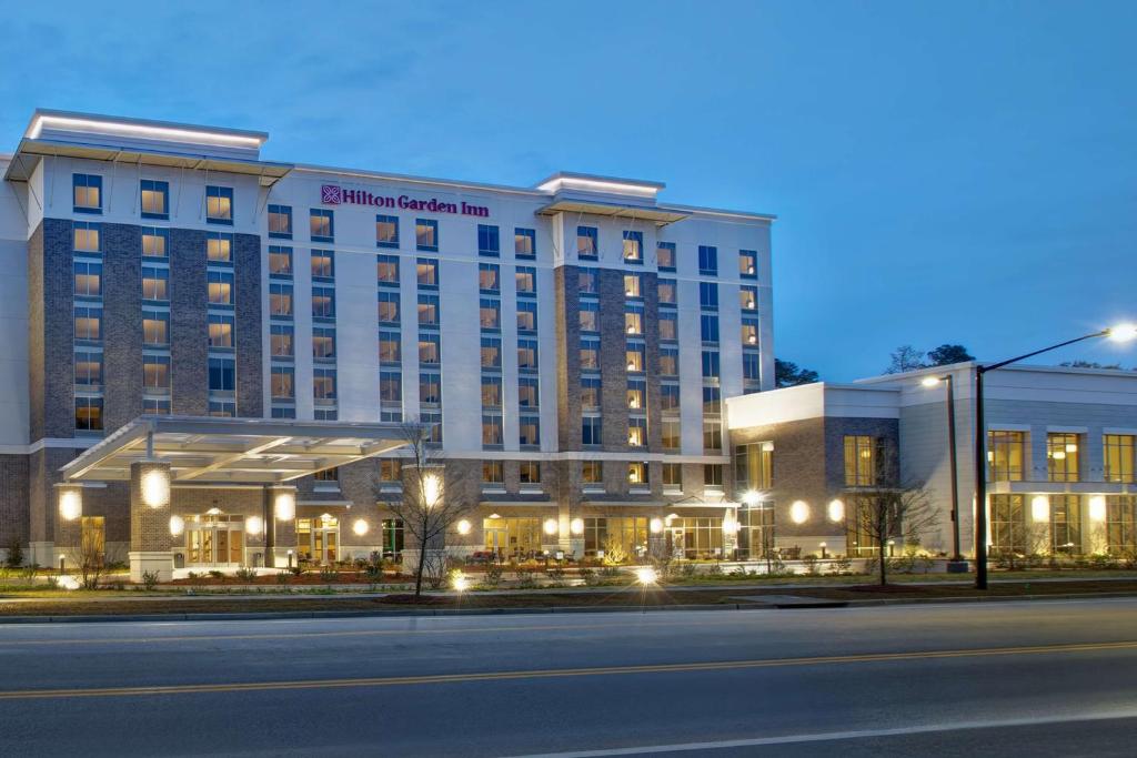 a large building with a hotel on the side of a street at Hilton Garden Inn Summerville, Sc in Summerville