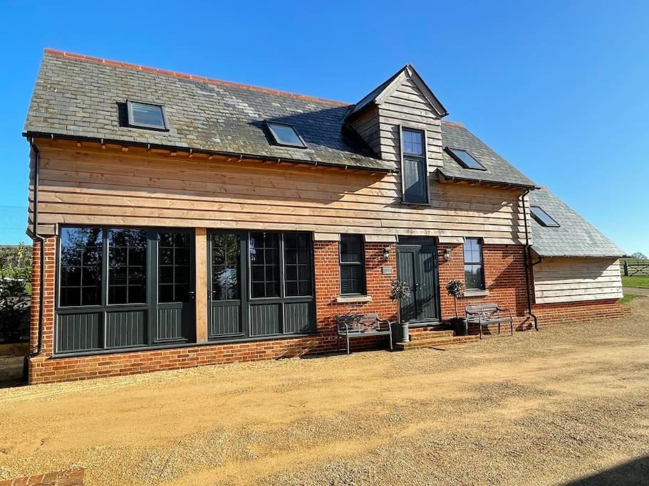 a house with a large window on the side of it at The Carriage House in Salisbury