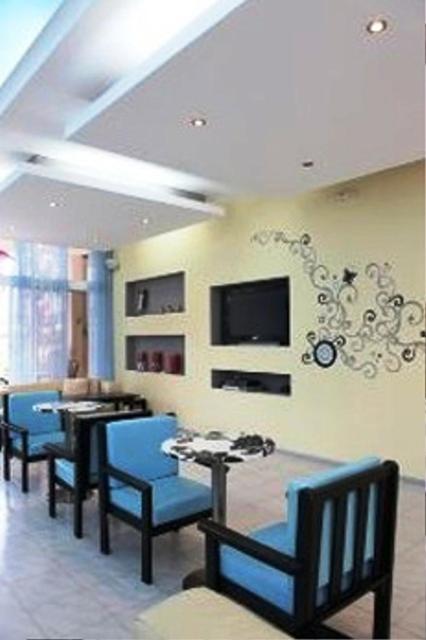 TV a/nebo společenská místnost v ubytování Rhodian Sun Hotel