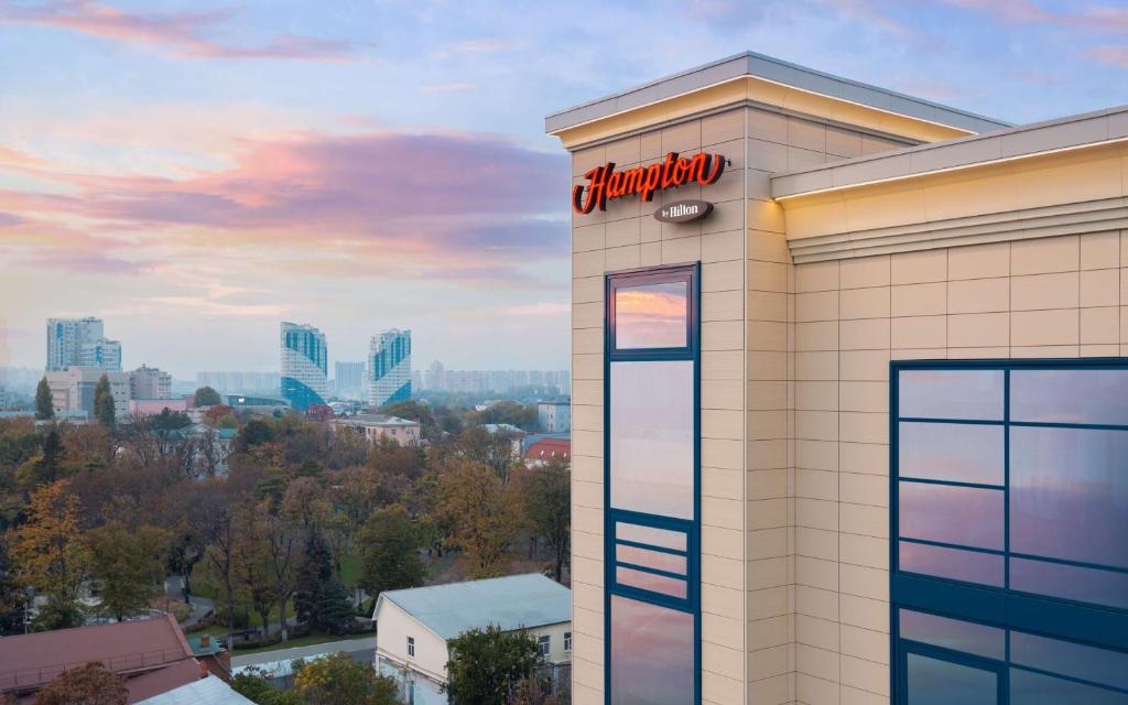 a chrysler building with a sign on it at Hampton By Hilton Krasnodar in Krasnodar