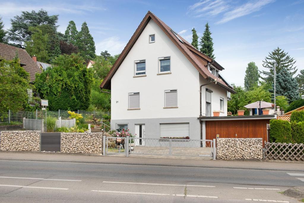 a white house on the side of a street at Ferienwohnung Kramer in Überlingen