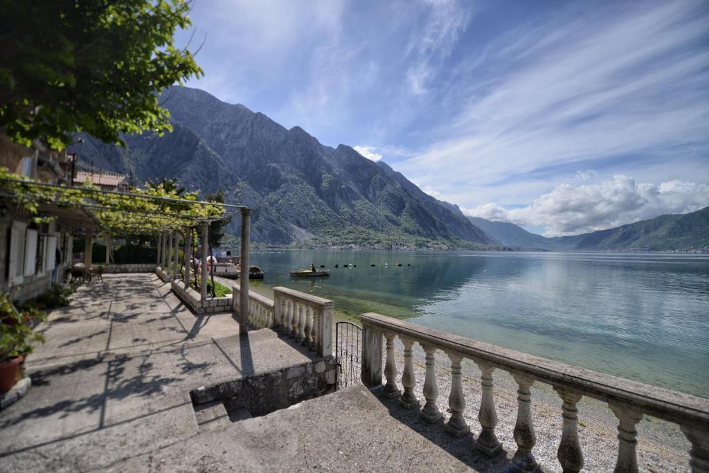 a view of a lake with mountains in the background at Apartments Goran in Kotor