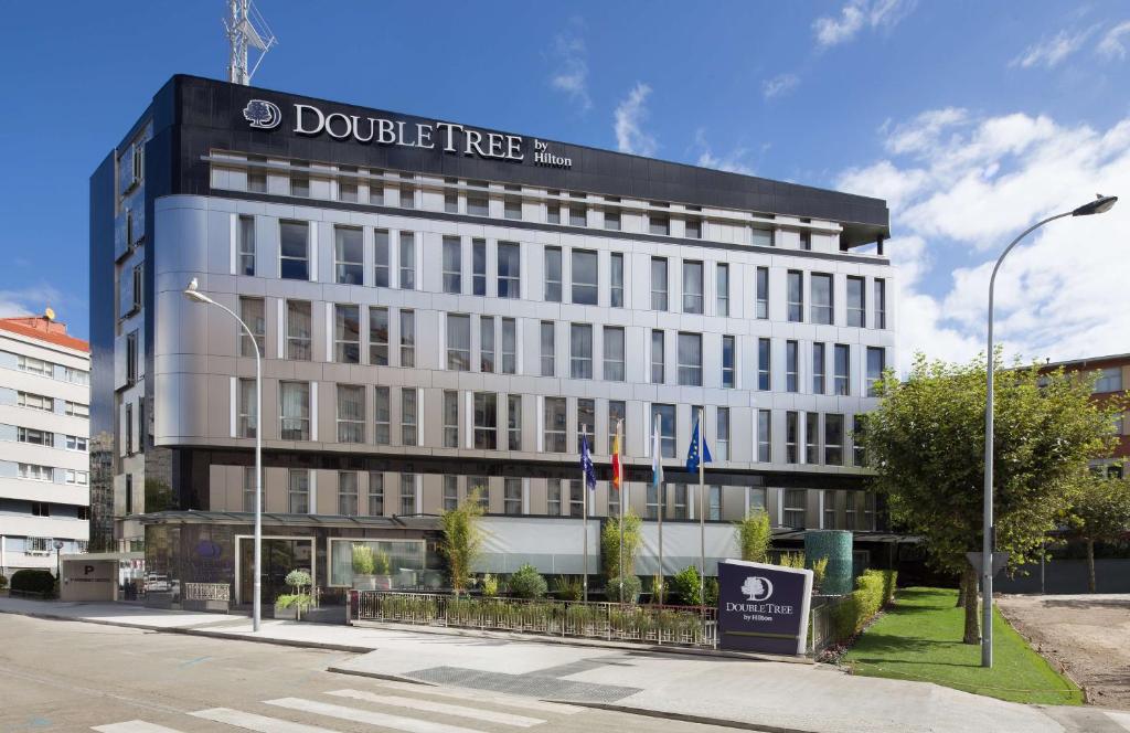 a building with a sign on the side of it at DoubleTree By Hilton A Coruña in A Coruña