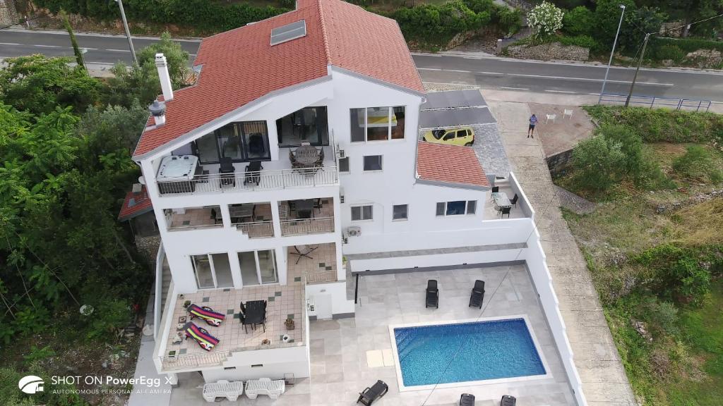 an overhead view of a house with a swimming pool at Ana in Preko
