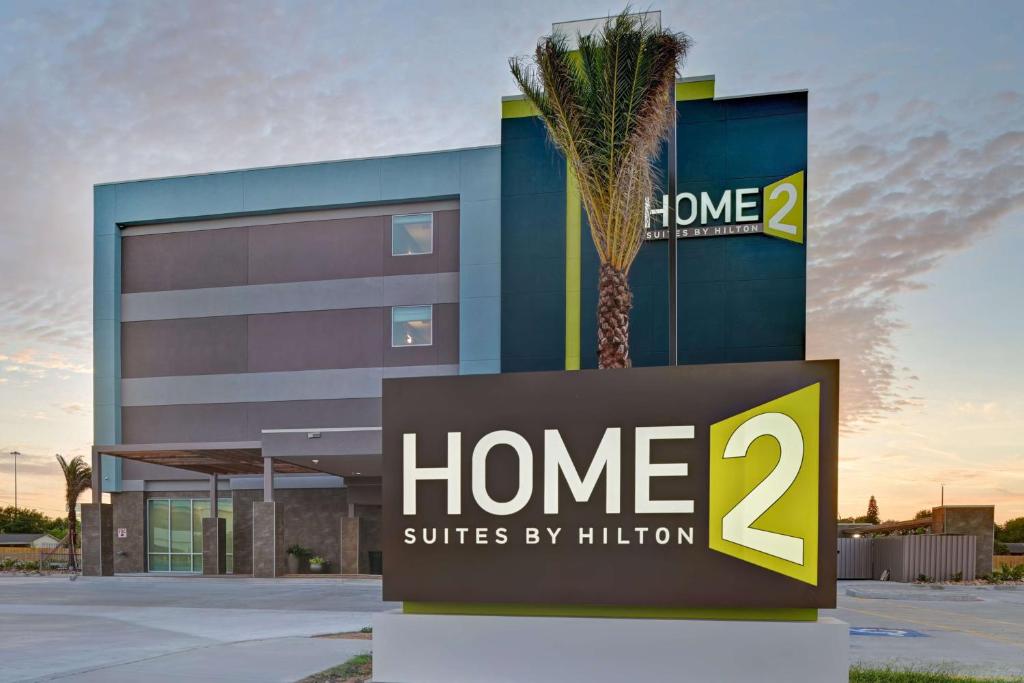 a home suites by hilton sign in front of a building at Home2 Suites Corpus Christi Southeast, Tx in Corpus Christi
