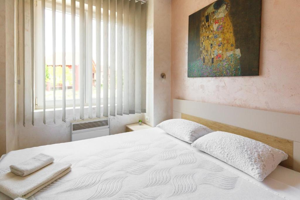 Postel nebo postele na pokoji v ubytování Apartments NANA