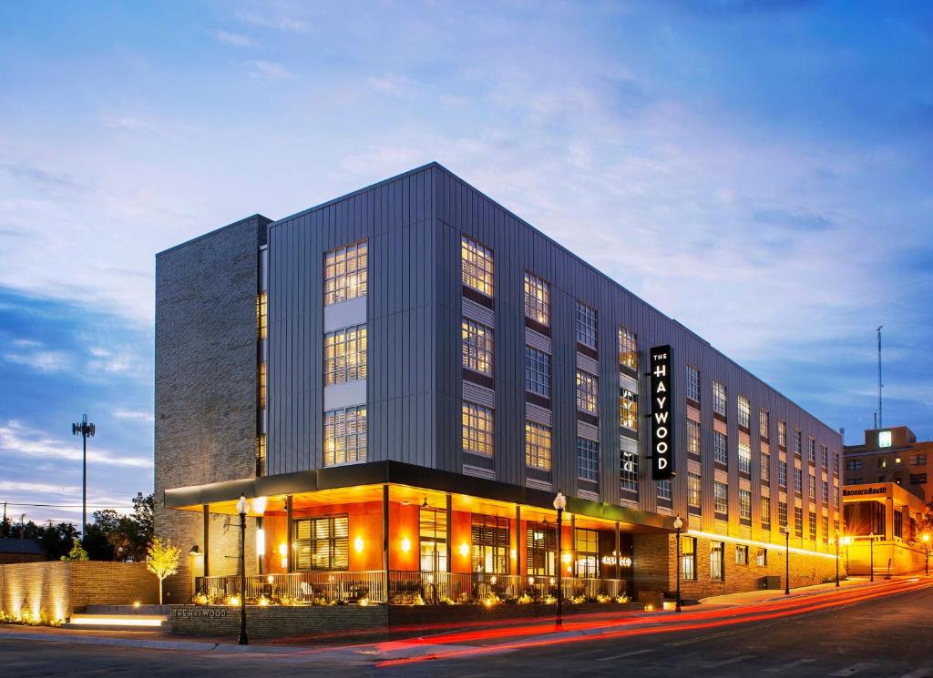 a large building with lights in front of it at The Haywood, Tapestry Collection by Hilton in El Dorado