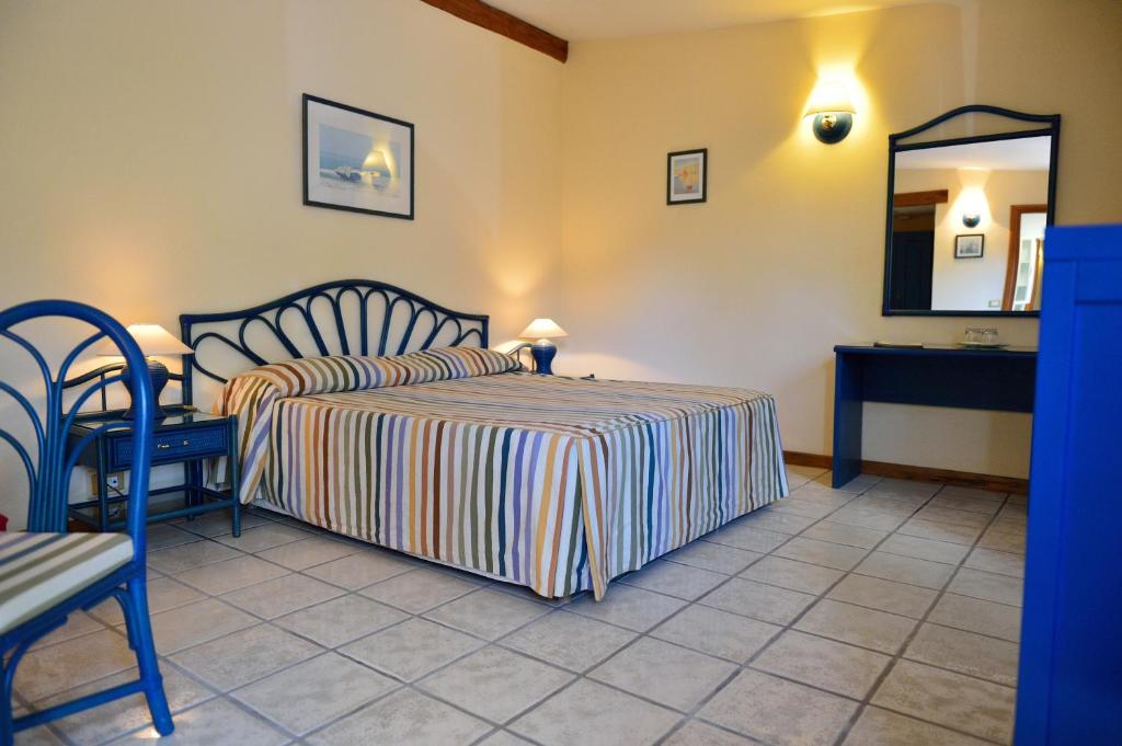 Postel nebo postele na pokoji v ubytování Hotel Acquasanta
