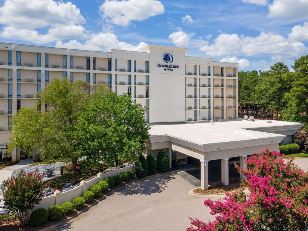 an image of the front of a hotel at DoubleTree by Hilton Raleigh Midtown, NC in Raleigh