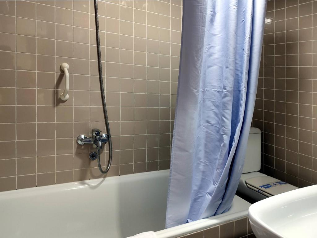 Koupelna v ubytování Hotel Porto