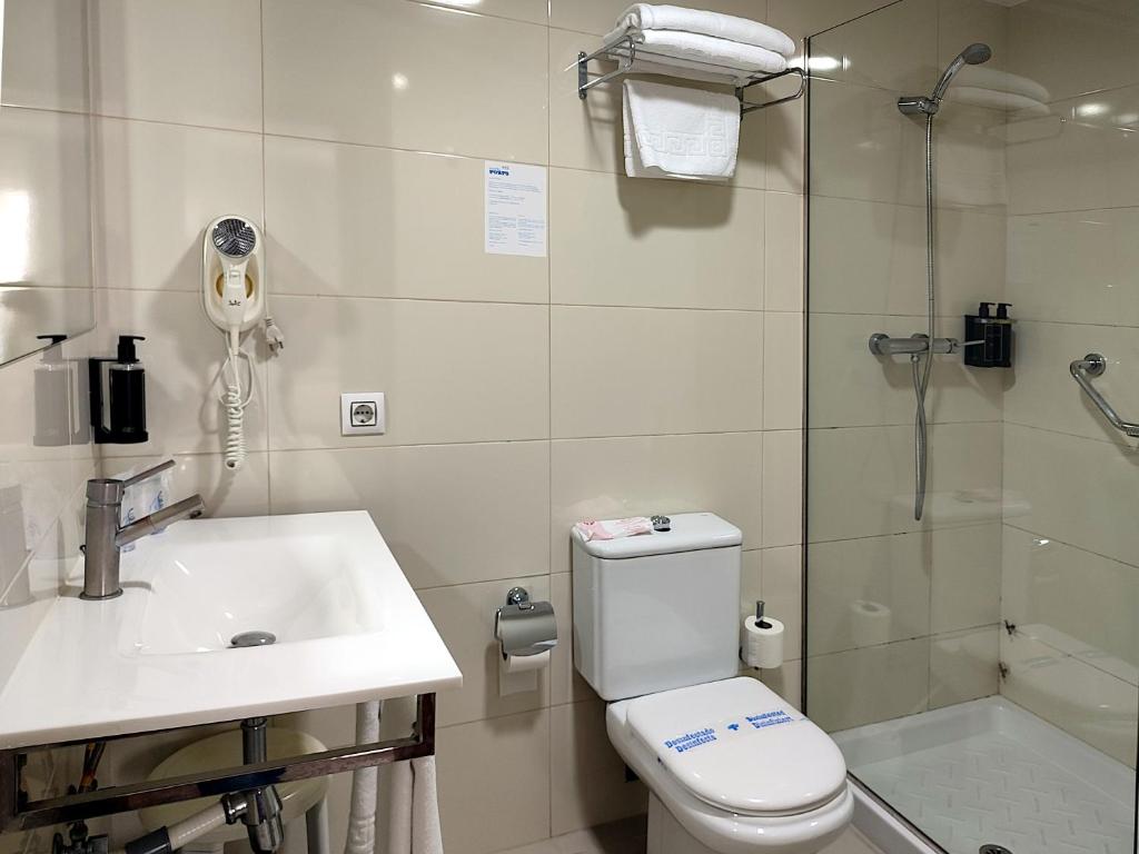 Koupelna v ubytování Hotel Porto