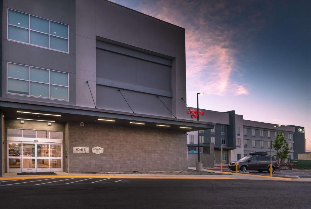 a building with a car parked in front of it at Hampton Inn Riverside March Air Force Base, Ca in Riverside