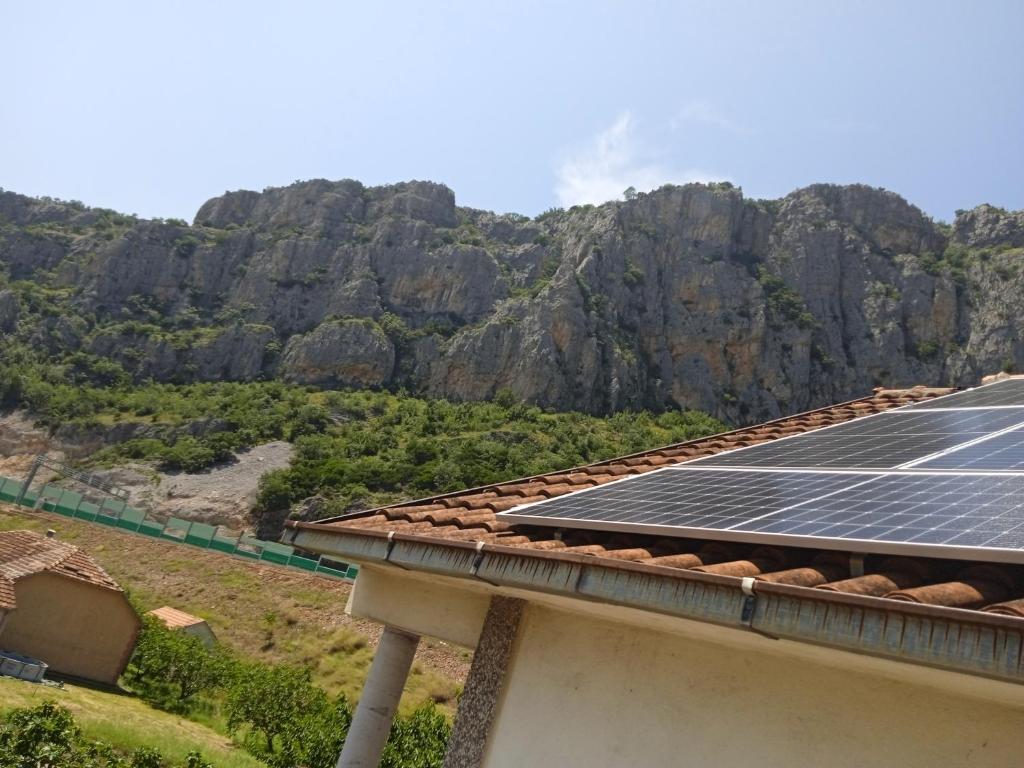 a roof with solar panels on top of a mountain at Villa Natalija in Podgorica