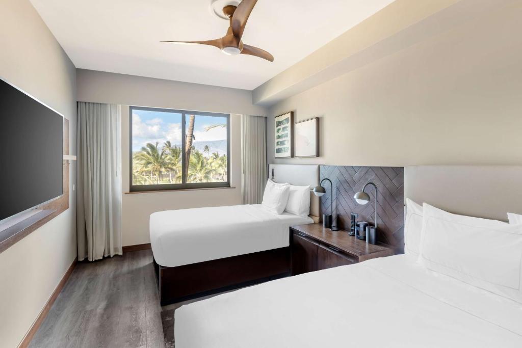 Postel nebo postele na pokoji v ubytování Hilton Grand Vacations Club Maui Bay Villas