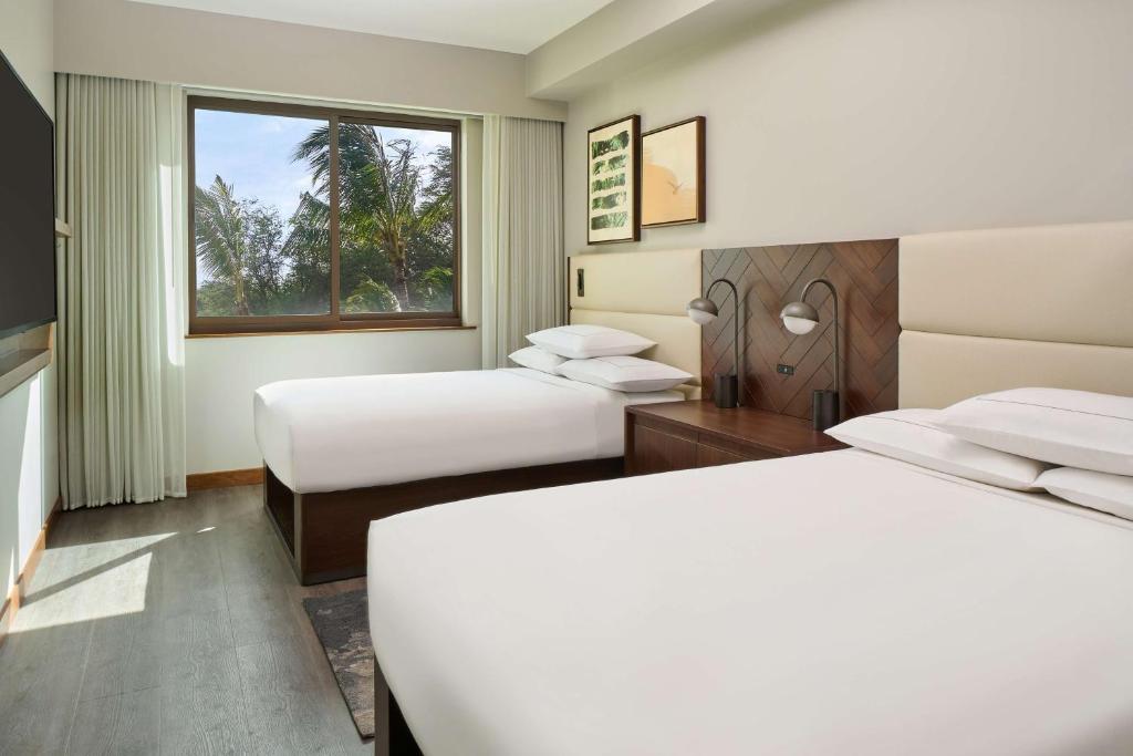 Postel nebo postele na pokoji v ubytování Hilton Grand Vacations Club Maui Bay Villas