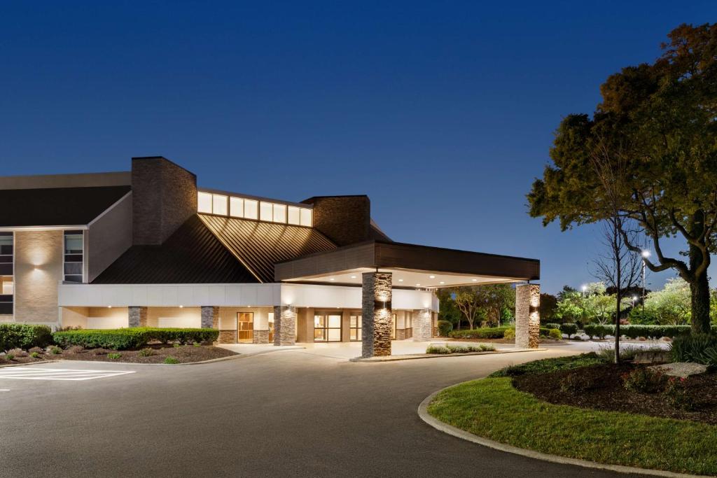 a large building with a parking lot in front of it at Doubletree By Hilton Columbus Dublin in Dublin