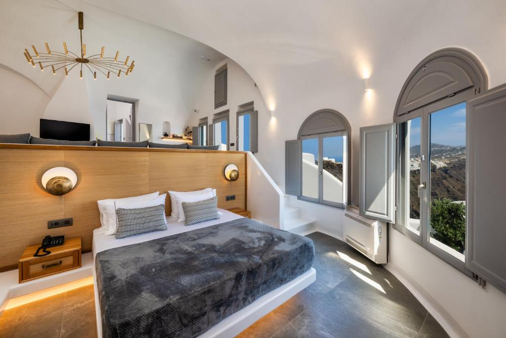 Postel nebo postele na pokoji v ubytování Eteoro Suites