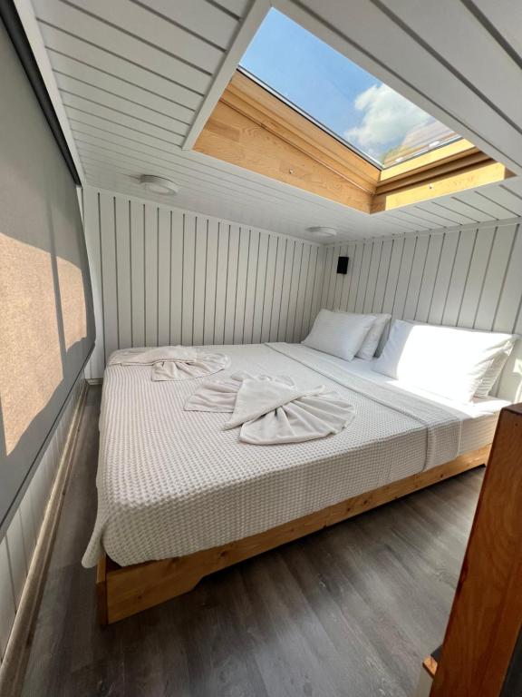 Postel nebo postele na pokoji v ubytování Grenadine Lodge