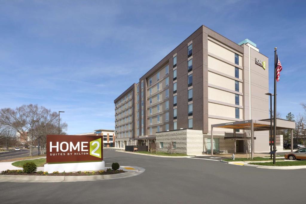 a hotel building with a sign in front of it at Home2 Suites By Hilton Richmond Short Pump in Richmond