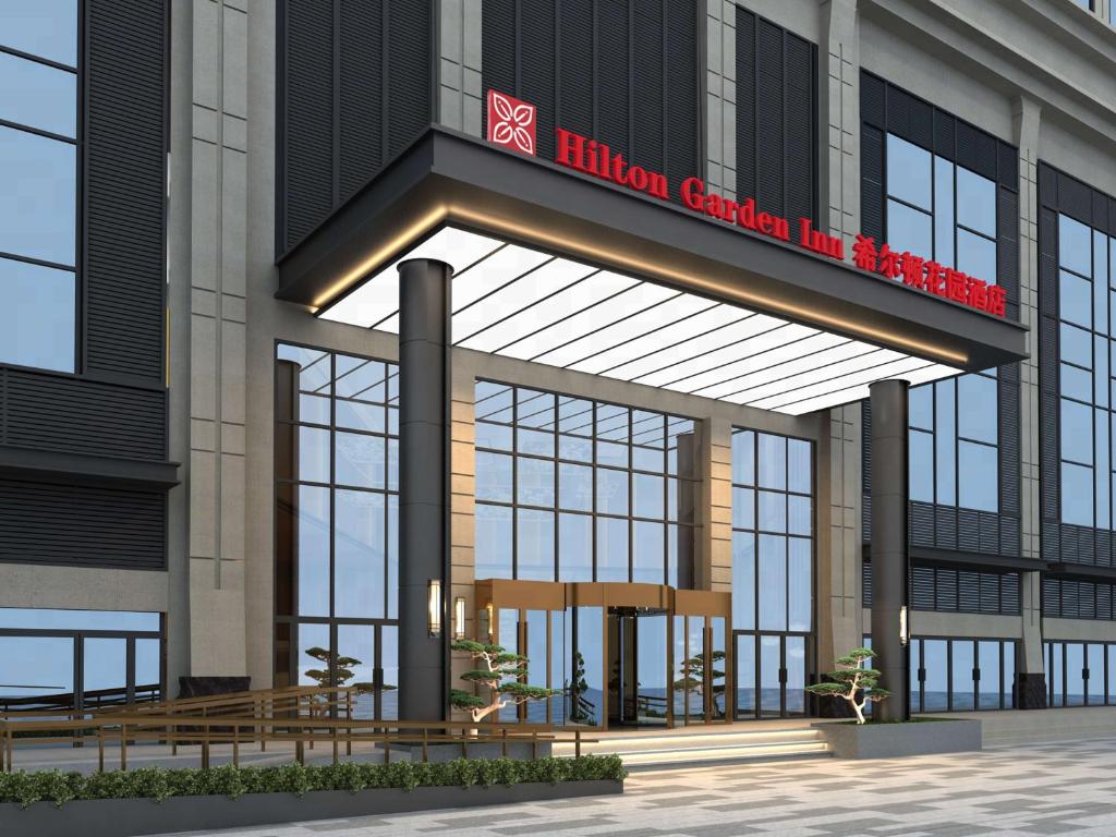 una representación de la entrada a un hotel en Hilton Garden Inn Jinzhou Central Street, en Jinzhou