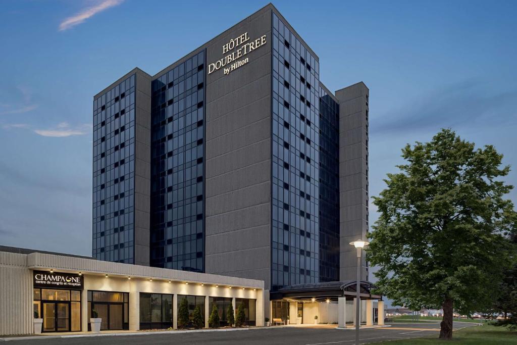 a rendering of a hotel with a building at Doubletree By Hilton Pointe Claire Montreal Airport West in Pointe-Claire