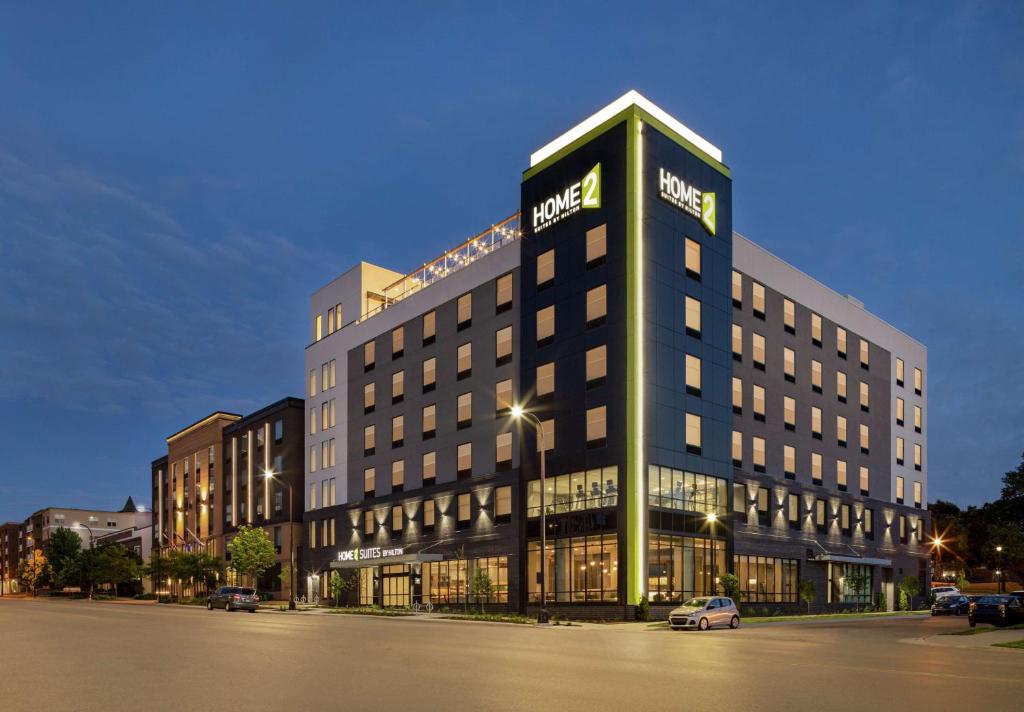 a hotel building with a sign on top of it at Home2 Suites By Hilton Minneapolis University Area in Minneapolis